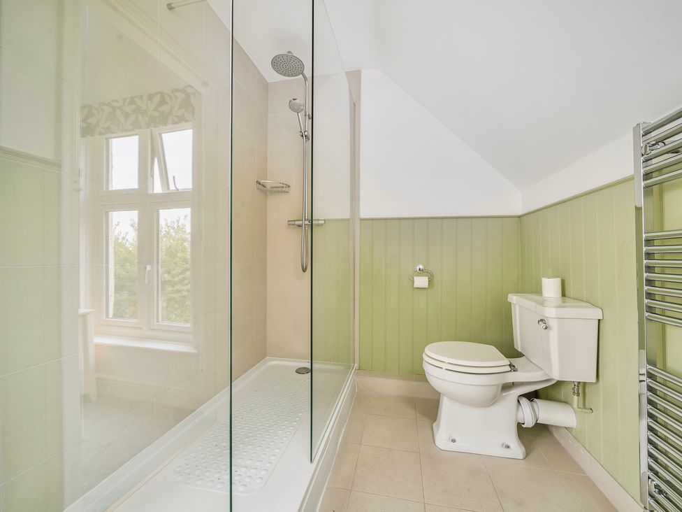 A bathroom with a shower and toilet at High House Southrepps