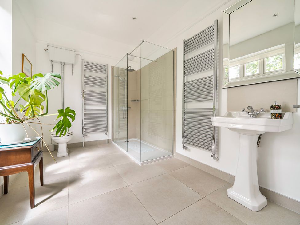 A bathroom with a shower and sink at High House in Southrepps