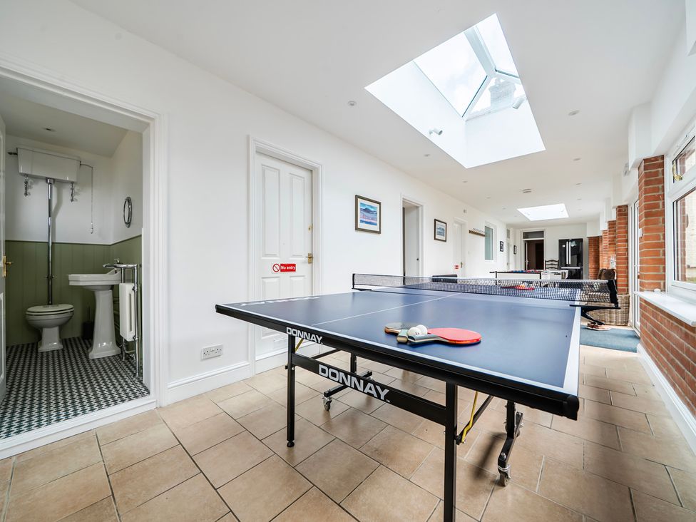 A games room with a ping pong table at High House in Southrepps