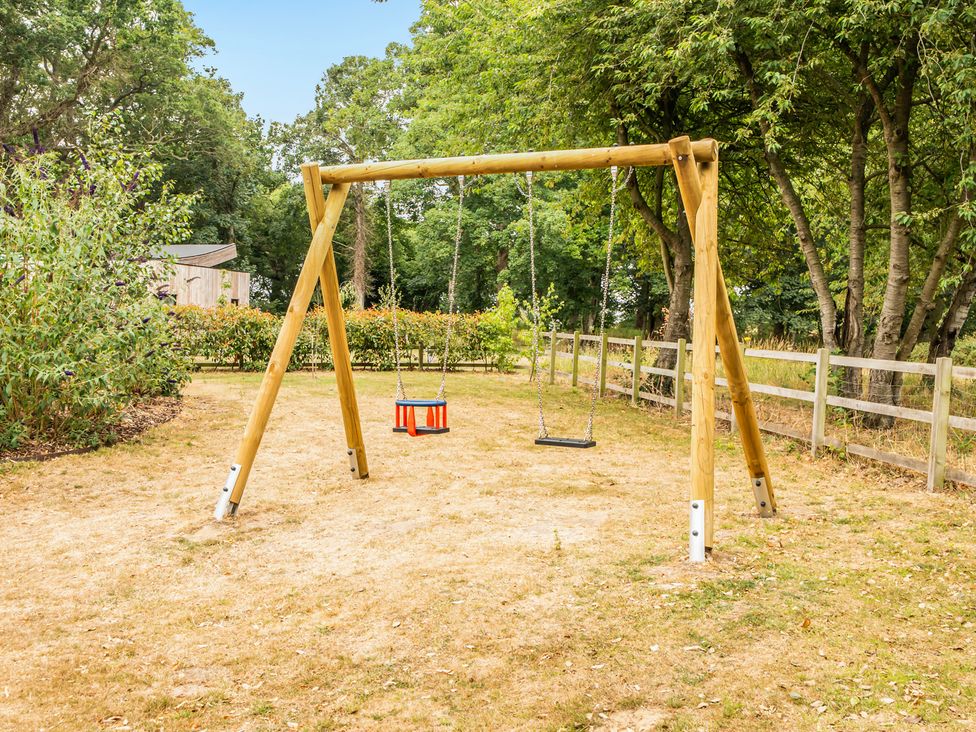 A swing set in a garden at High House in Southrepps