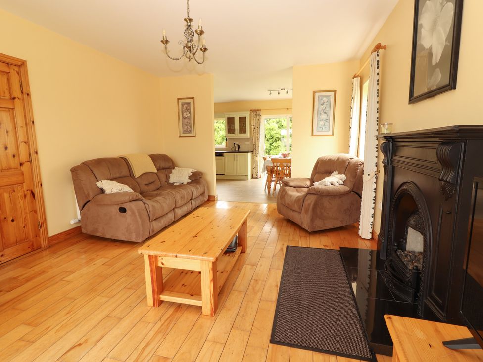 A living room with a sofa and coffee table at 29 Church Field in Doonbeg, County Clare