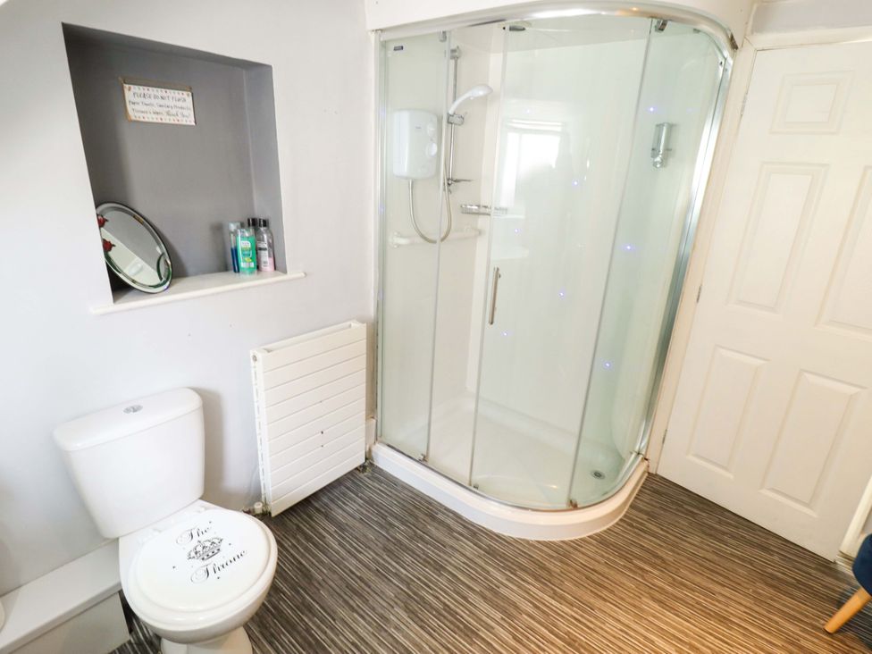 A bathroom with a shower and toilet at Peartree Cottage