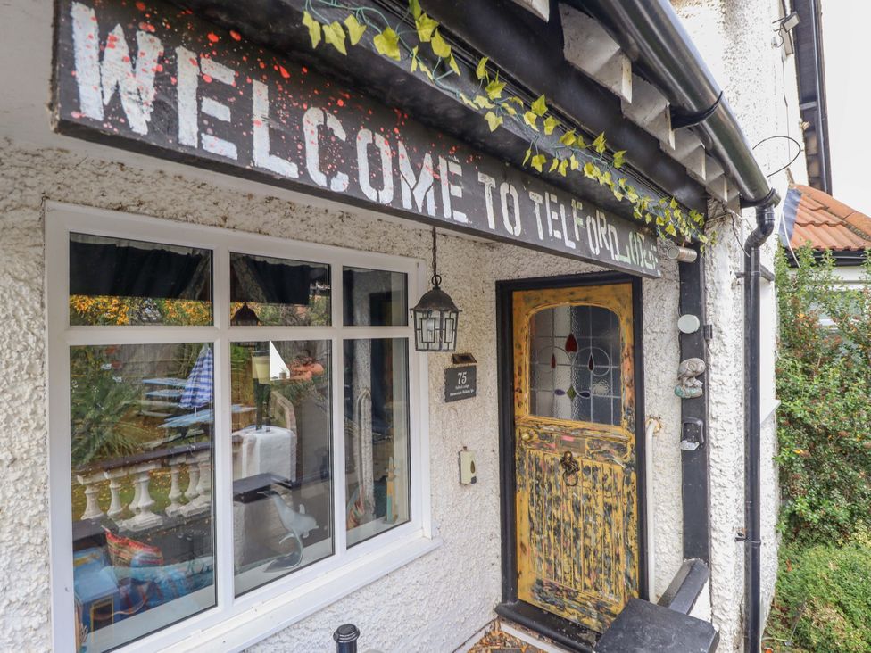 An entrance with a welcome sign at Telford Lodge in Skegness