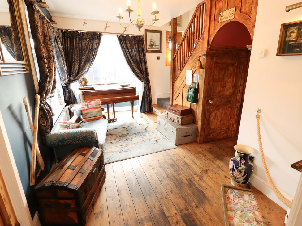 An entryway with a piano and decorative items at Telford Lodge Skegness