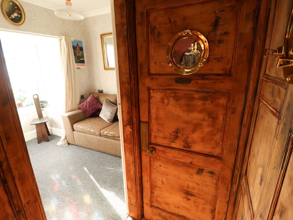 A living room with a sofa and a table at Telford Lodge in Skegness