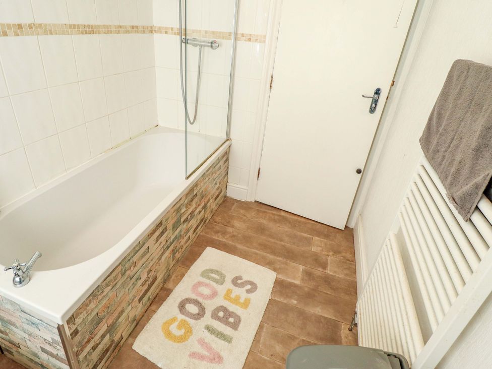 A bathroom with a bathtub and shower at Telford Lodge in Skegness