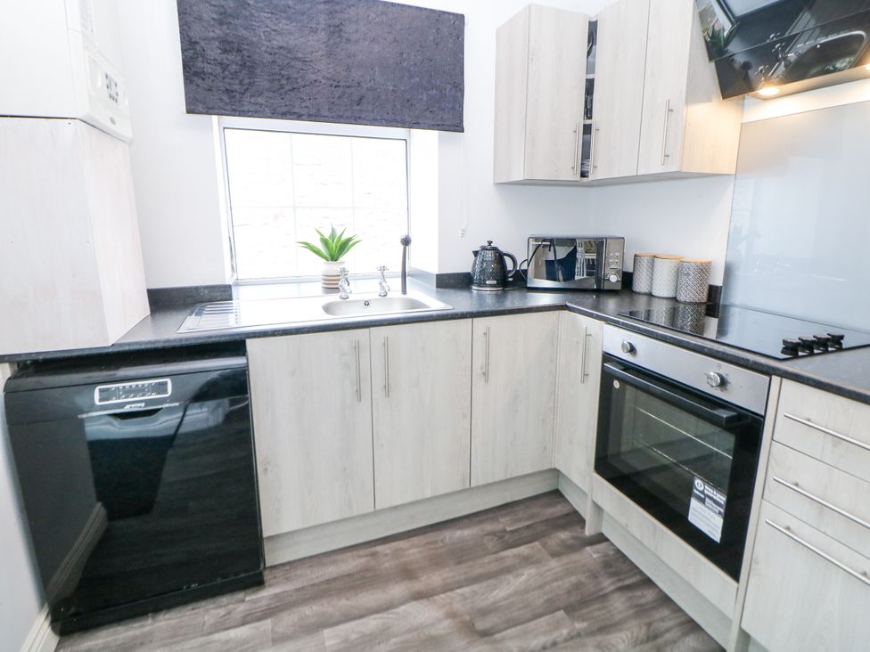 A kitchen with appliances and cabinetry at 15 South Avenue Mews Buxton