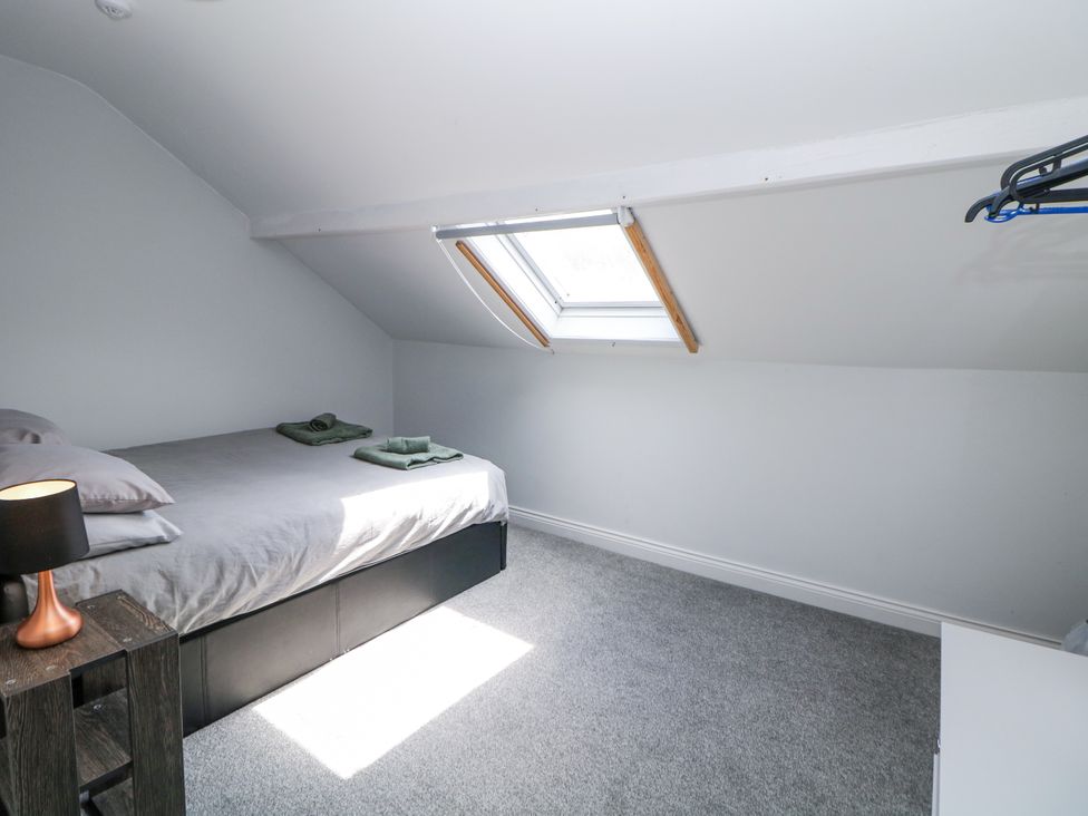 A bedroom with a bed and a skylight at 15 South Avenue Mews Buxton