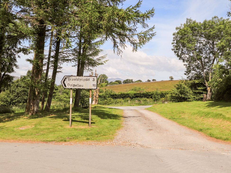 A road junction with signpost directions in the countryside at Babbling Brook near Blaenau Ffestiniog