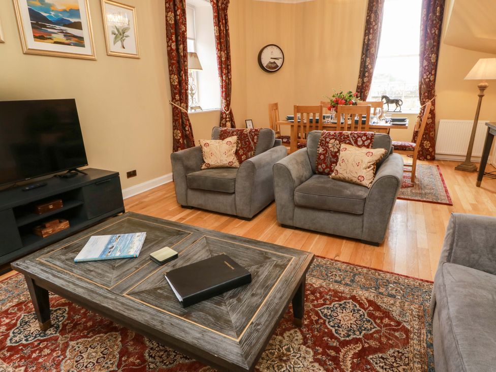 A living room with a TV and coffee table at Clocktower - Culzean Castle, Maybole