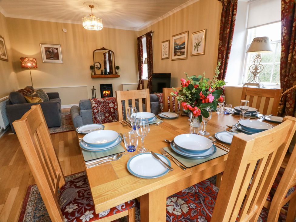 A dining room with a table set for a meal at Clocktower - Culzean Castle in Maybole