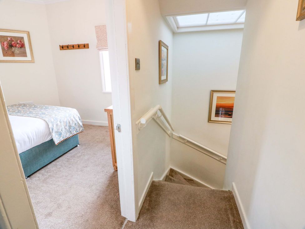 A bedroom with a bed and staircase at Clocktower - Culzean Castle in Maybole