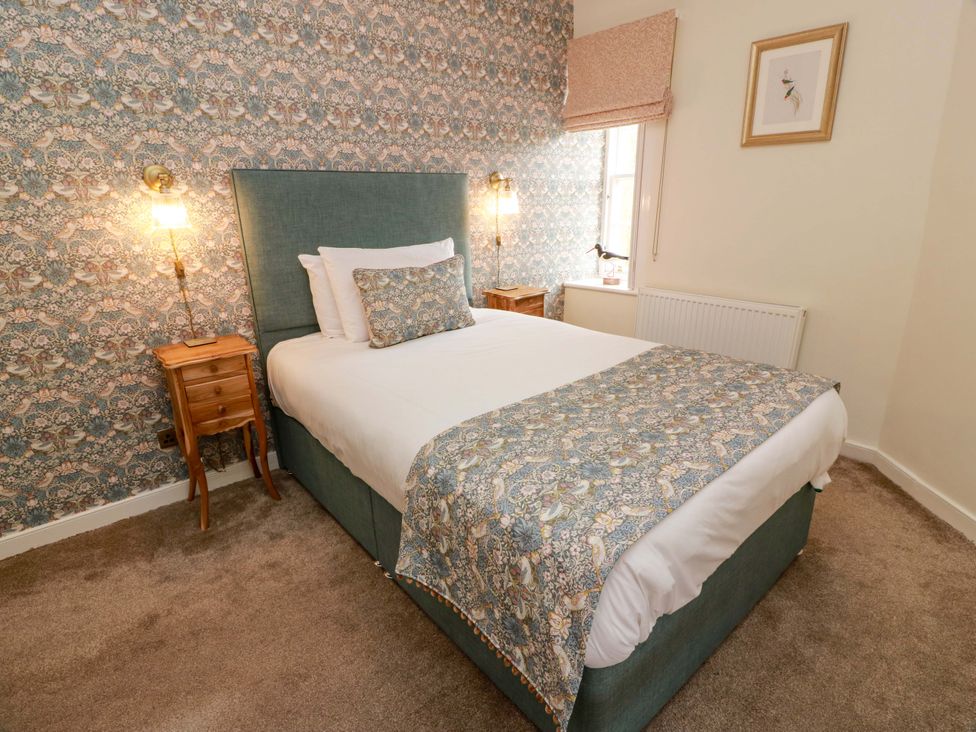 A bedroom with a bed and bedside table at Clocktower - Culzean Castle, Maybole