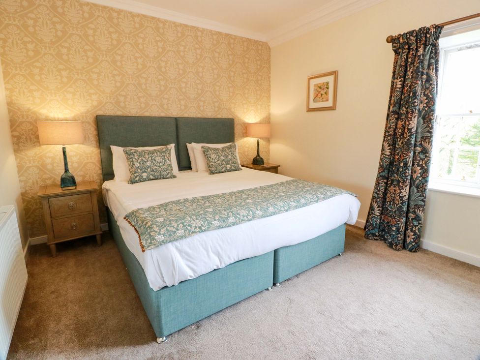 A bedroom with a bed and nightstands at Clocktower - Culzean Castle, Maybole