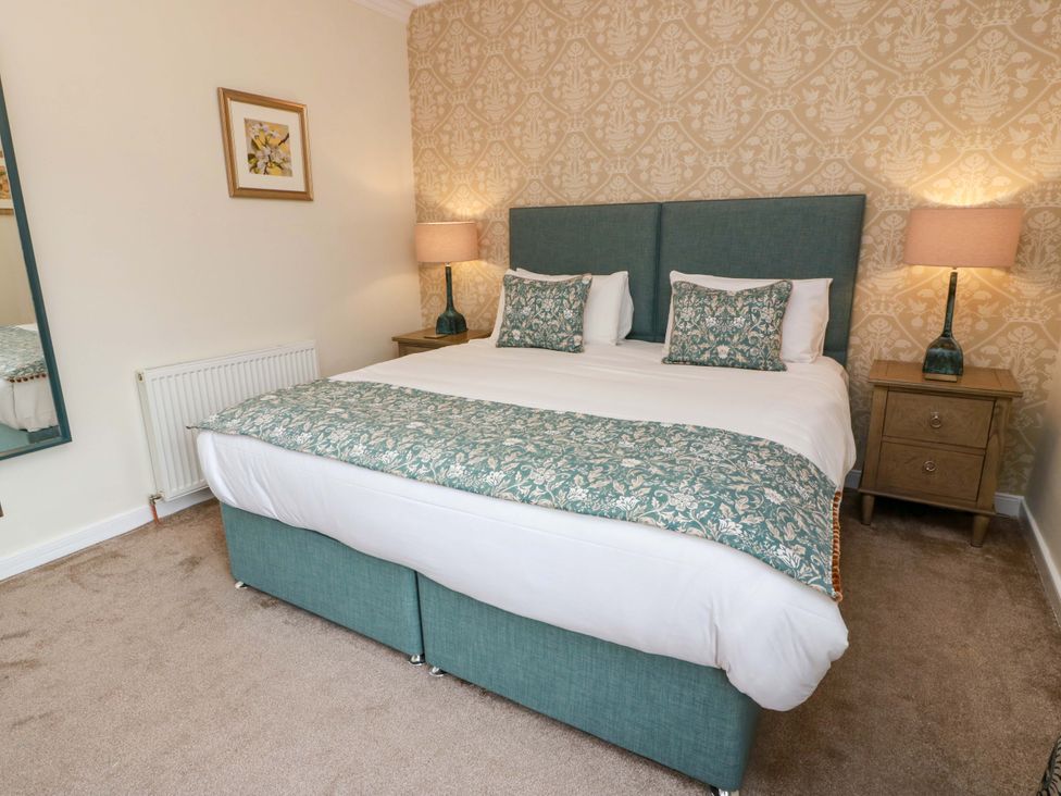 A bedroom with a bed and bedside tables at Clocktower - Culzean Castle in Maybole