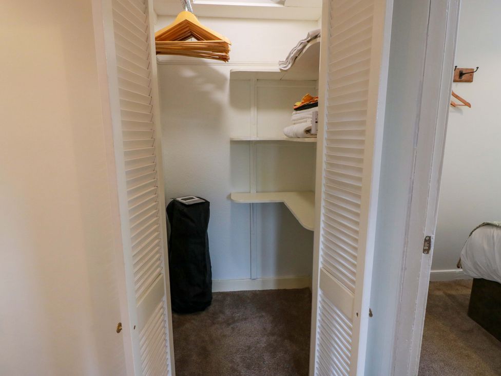 A closet with shelves and hangers at Clocktower - Culzean Castle in Maybole