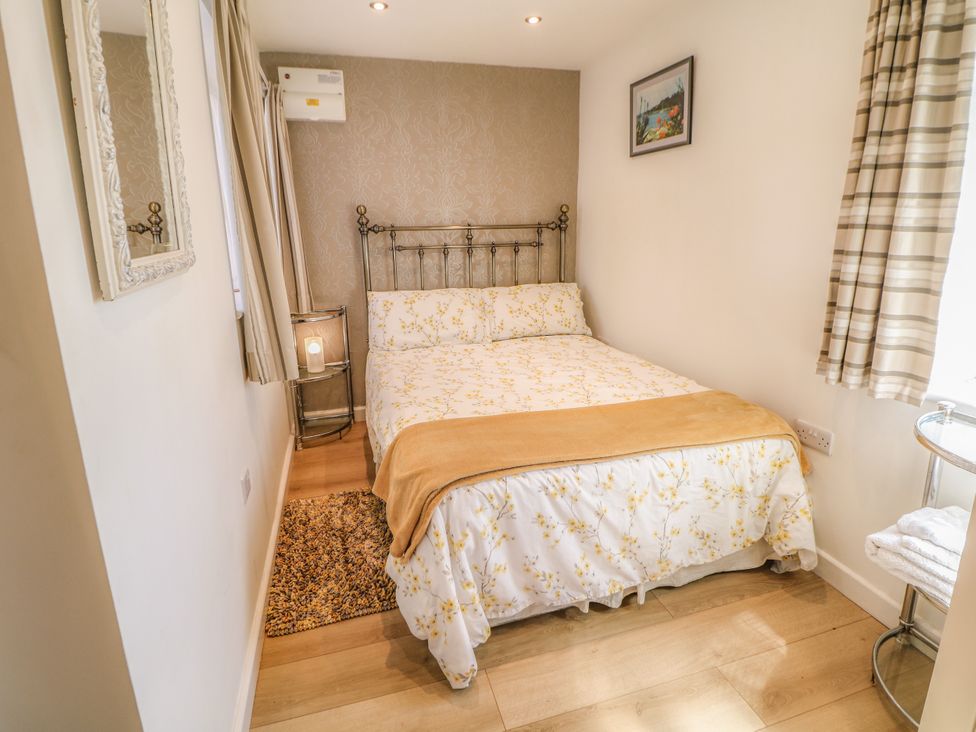 A bedroom with a bed and bedside table at The Netty in Flash