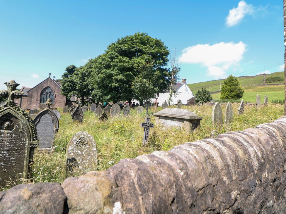 A graveyard with gravestones and trees at The Netty in Flash