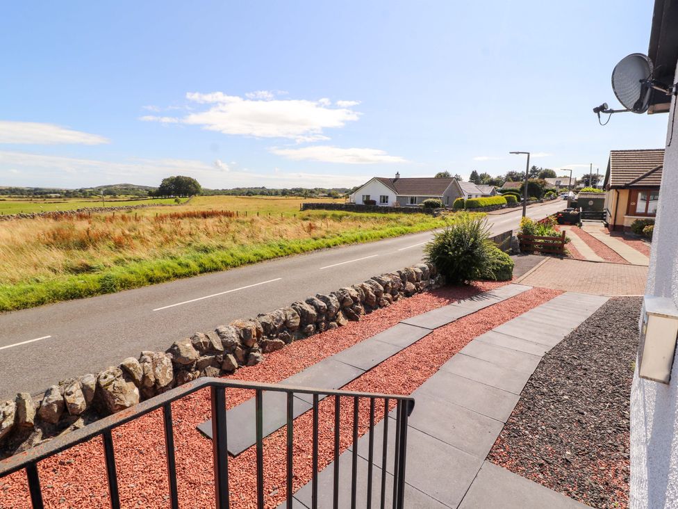 A view from a house showing a road and fields at The Paddock in Kirkcowan