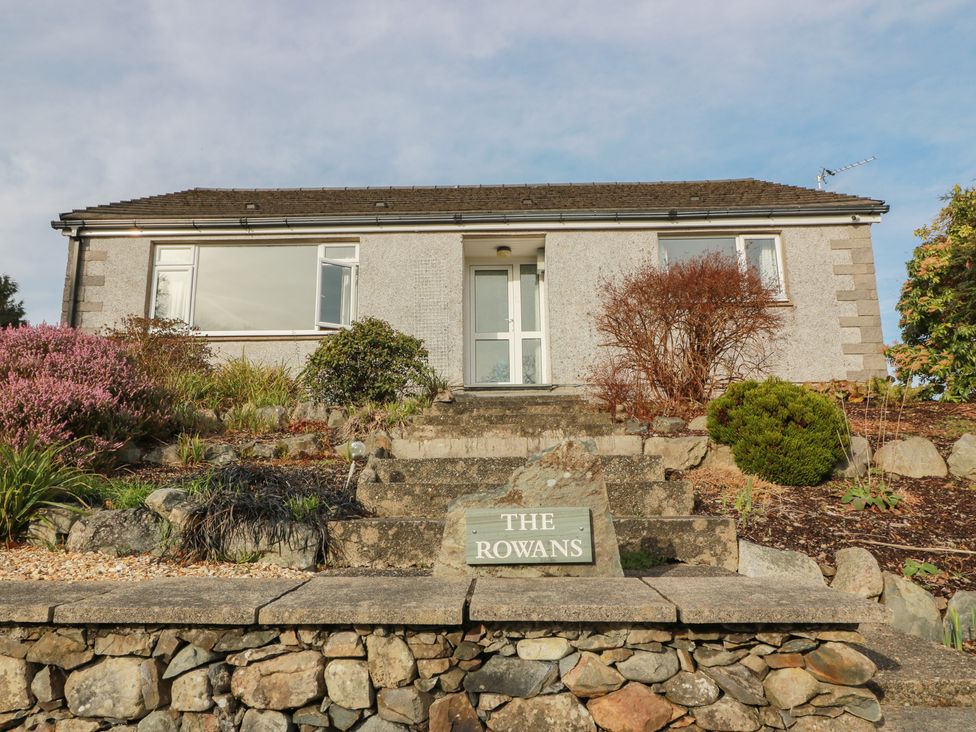 A house with steps and plants outside at The Rowans