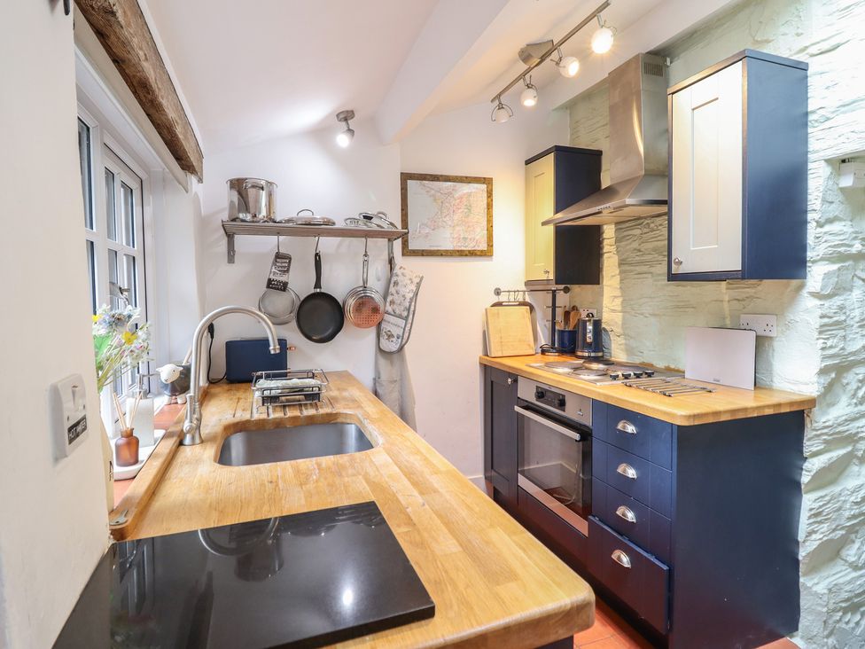 A kitchen with a sink and countertop at Preswylfa in Ffestiniog