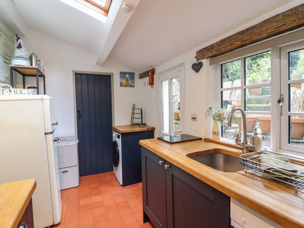 A kitchen with a sink and countertop at Preswylfa in Ffestiniog