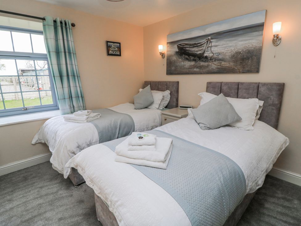 A bedroom with two single beds at Carthouse in Brean