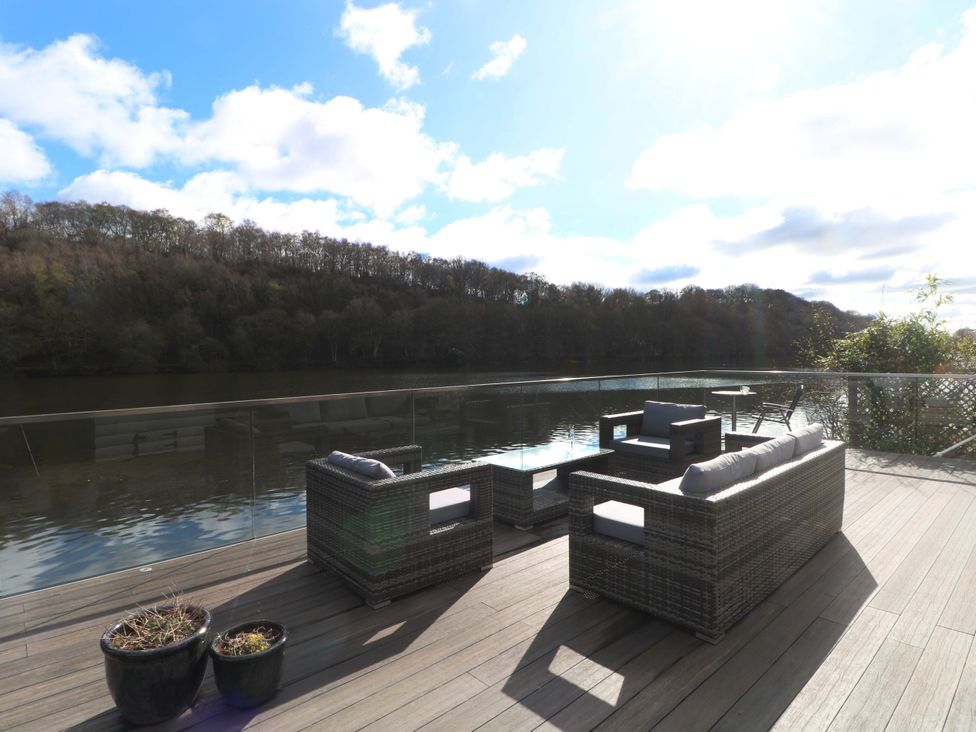 An outdoor seating arrangement with chairs and table at The Bothy in Leek