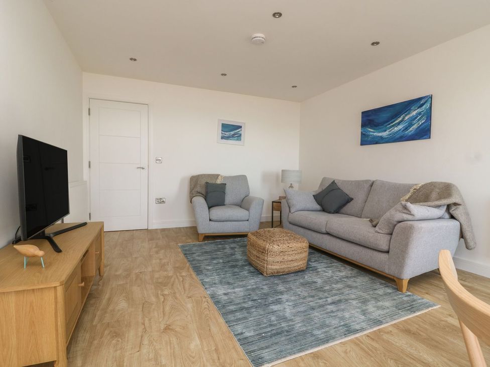 A living room with a sofa and television at The Lookout in 