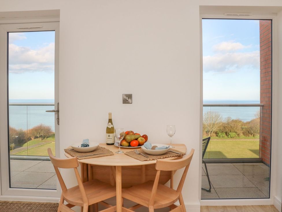 A dining room with a table and chairs at The Lookout in 