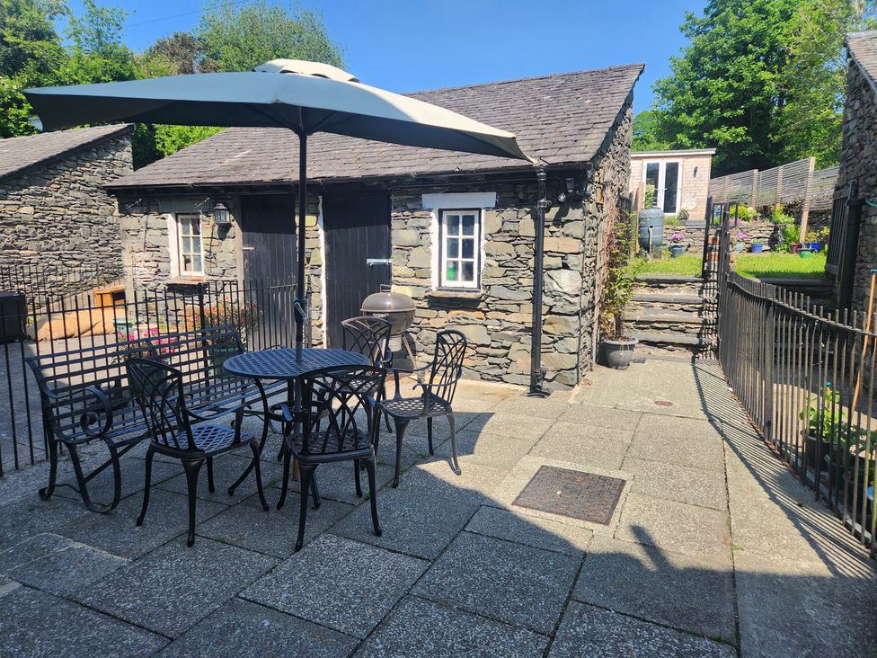 A patio with a table and chairs at 1A Lower Croft Street Settle