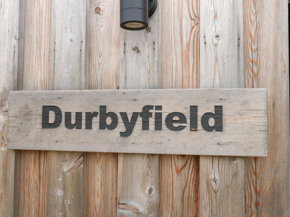 A wooden sign displaying the name Durbyfield in Nottington near Weymouth