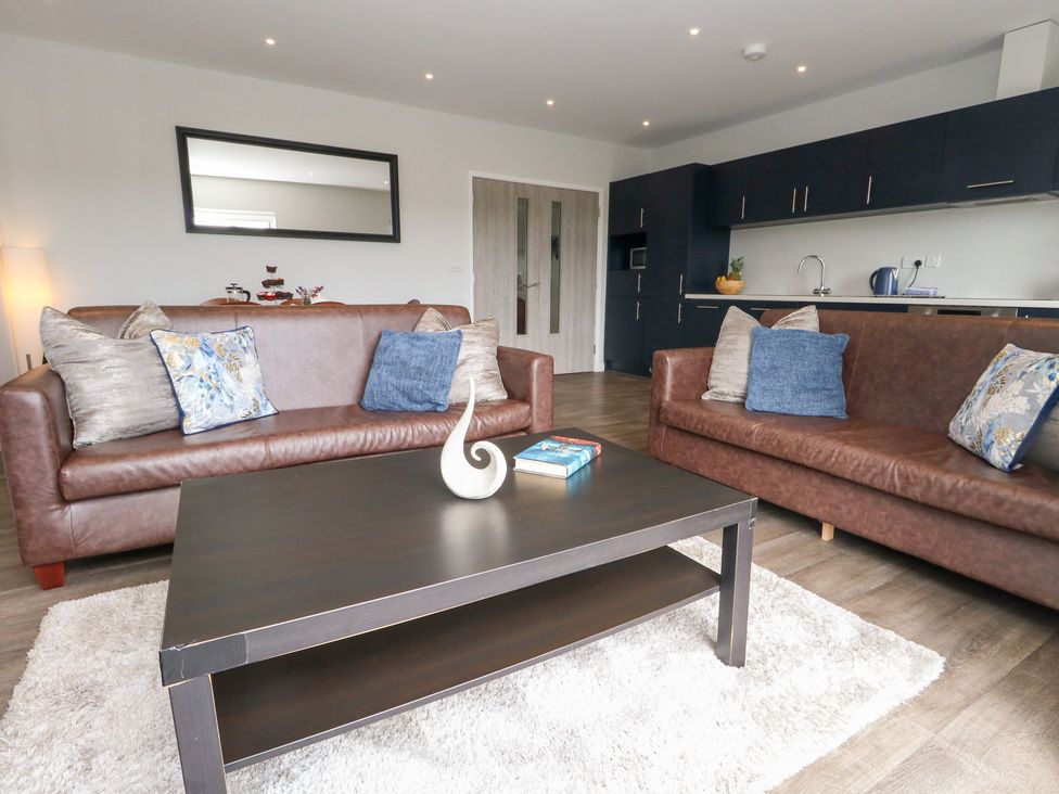 A living room with sofas and a coffee table at Durbyfield Nottington near Weymouth