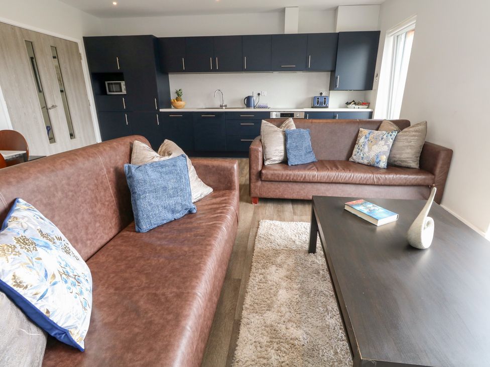 A living room with a sofa and coffee table at Durbyfield Nottington near Weymouth