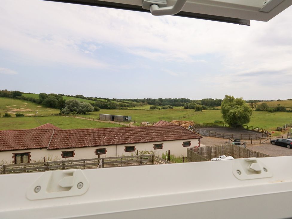 A view of fields and buildings from a window at Durbyfield in Nottington near Weymouth