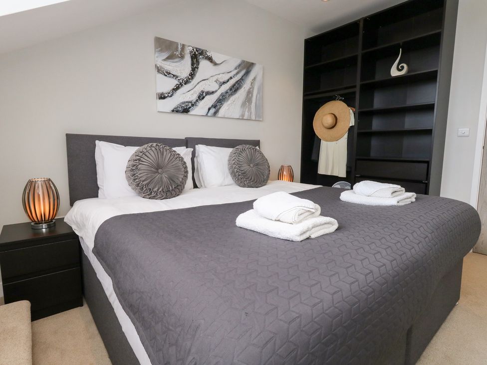 A bedroom with a bed and lamp at Durbyfield Nottington near Weymouth