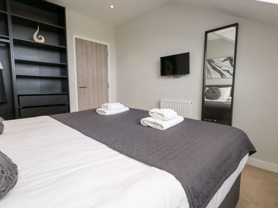 A bedroom with a bed and a television at Durbyfield Nottington near Weymouth