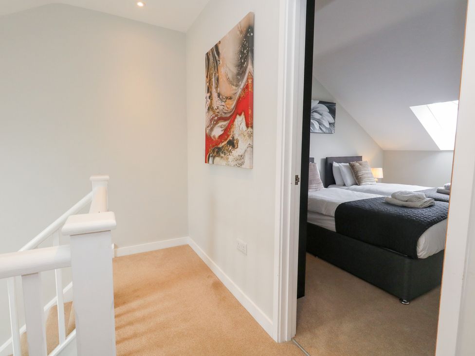 A hallway with an artwork and a bedroom visible at Durbyfield Nottington near Weymouth