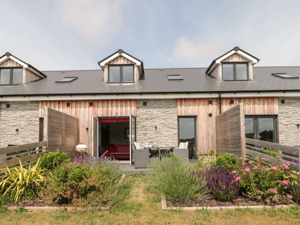 A house with patio furniture and plants at Egdon Heath Nottington near Weymouth