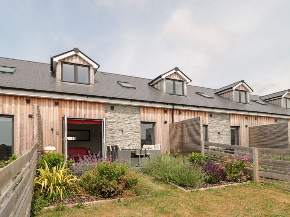 A house with a garden and patio area at Egdon Heath Nottington near Weymouth