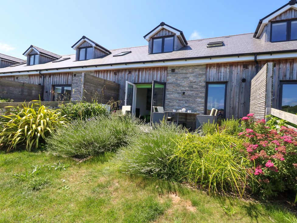 An outdoor area with garden and seating at Overcombe Mill in Nottington near Weymouth