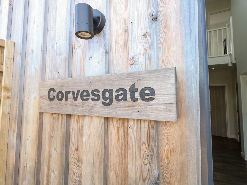 A wooden sign with the name Corvesgate at Corvesgate in Nottington near Weymouth