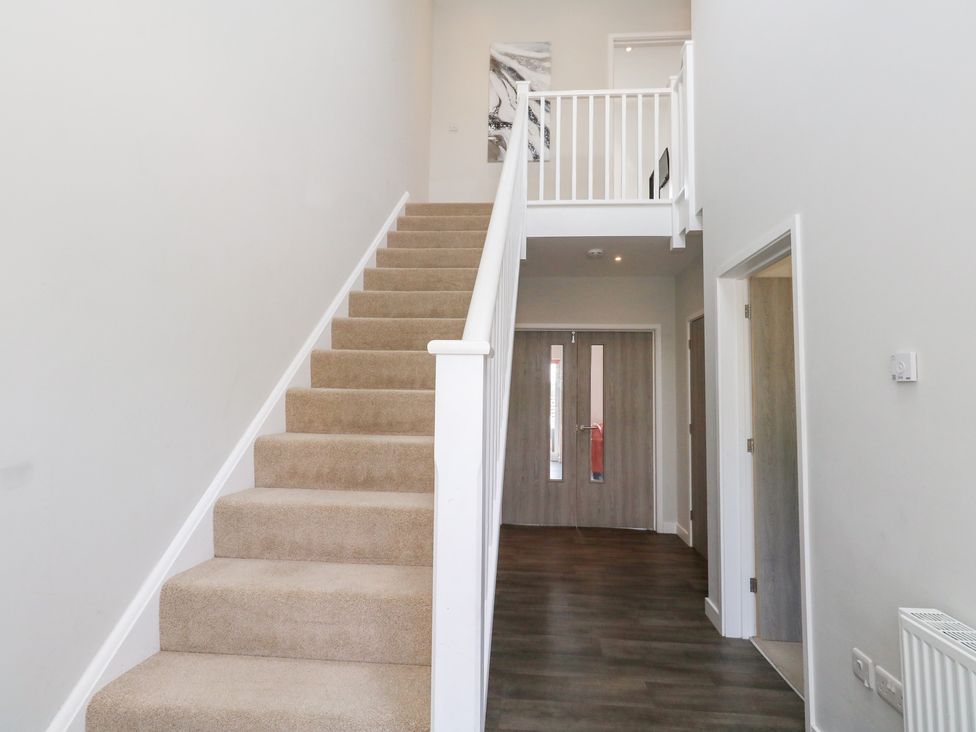 A staircase and hallway at Corvesgate in Nottington near Weymouth