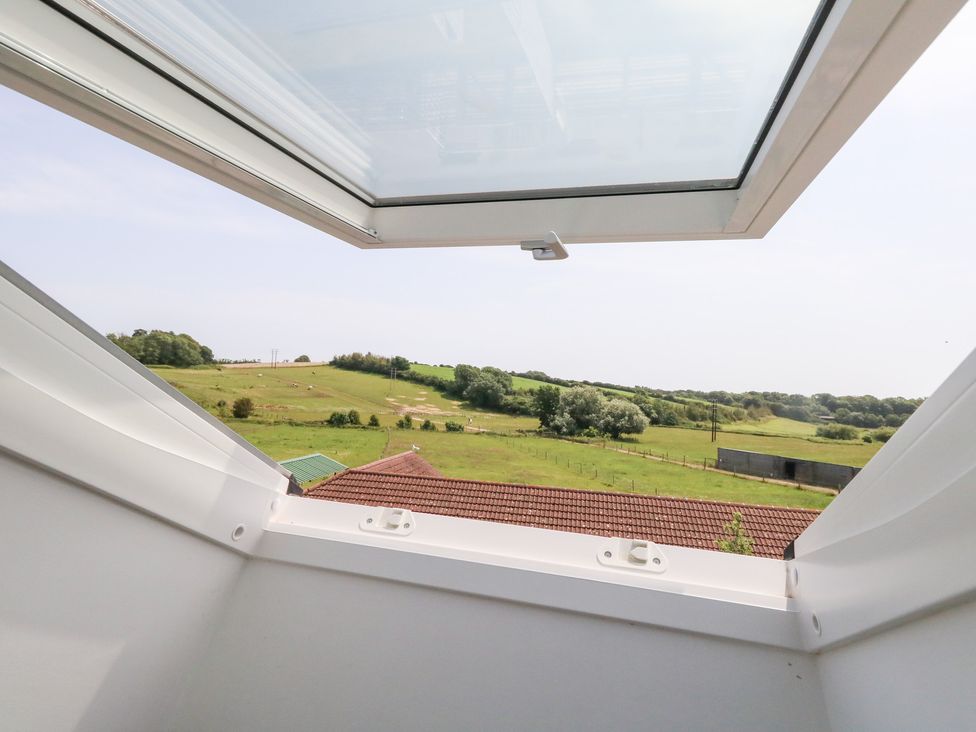 A view from a window showing fields and hills at Corvesgate in Nottington near Weymouth