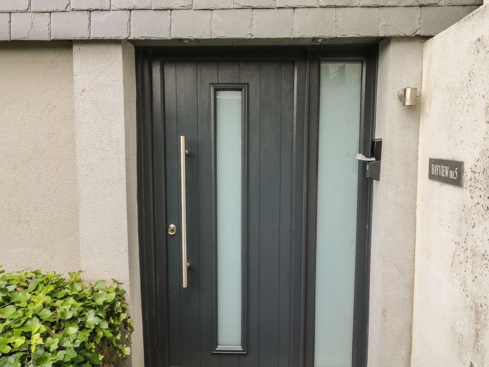 A black door with glass panels at Bay View in Brixham