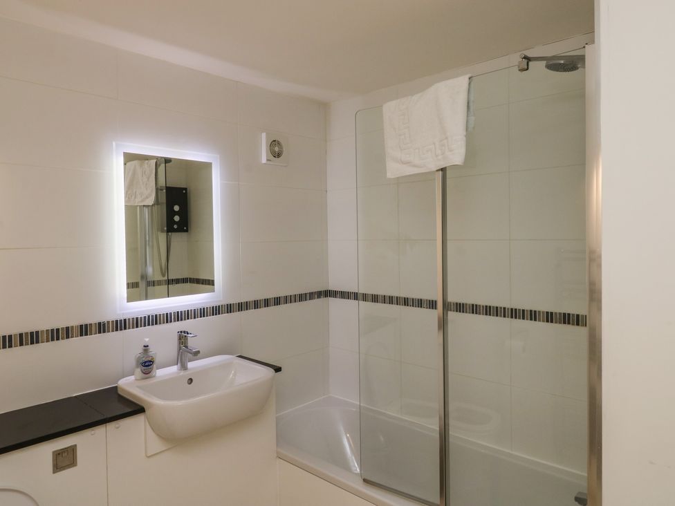 A bathroom with a shower and a sink at Bay View in Brixham
