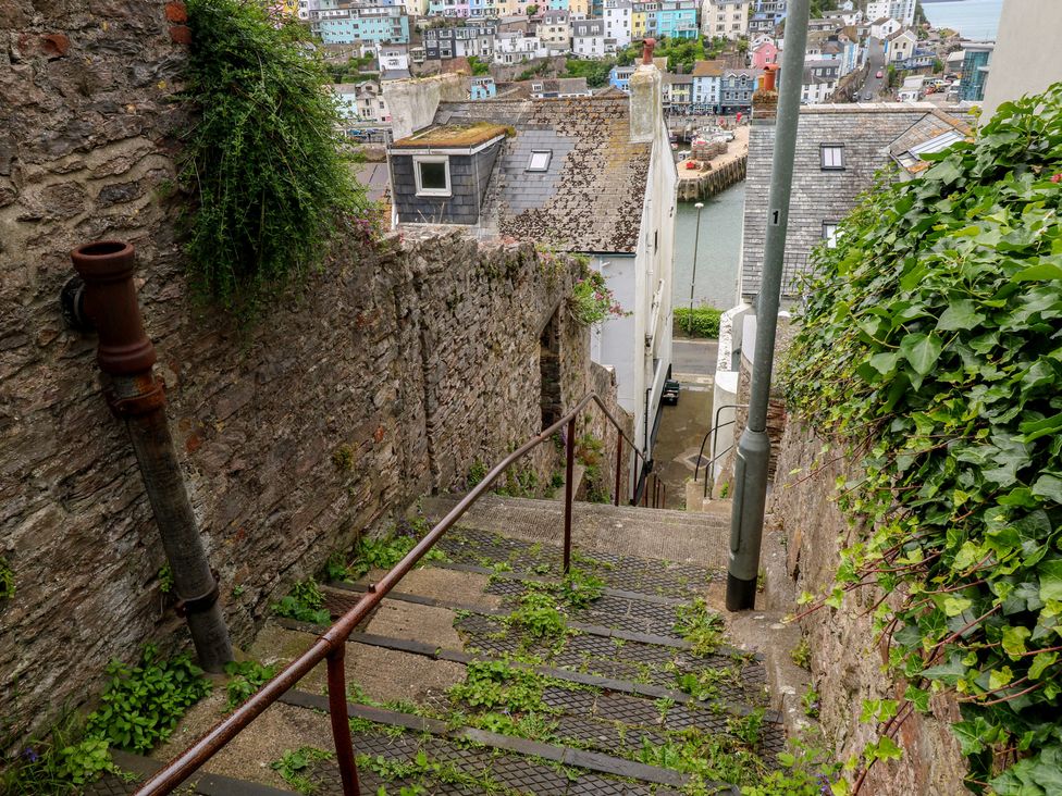A staircase leading down to a road at Bay View in Brixham