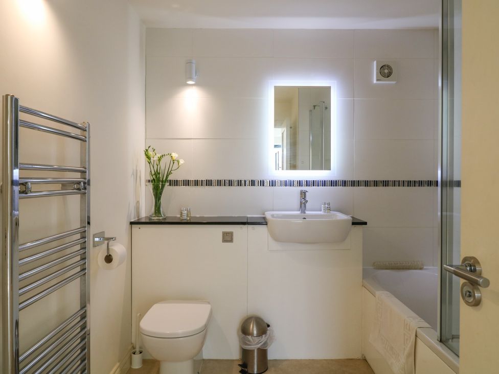 A bathroom with a sink and toilet at Bay View in Brixham