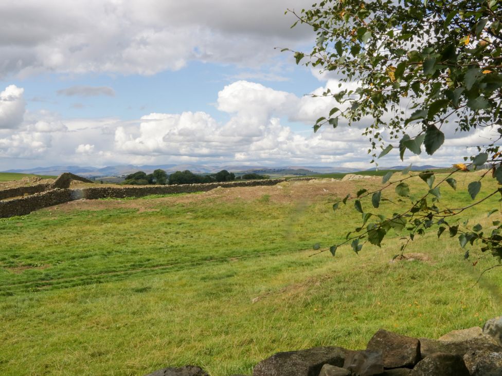 A landscape with grass and stone walls at Howgills Retreat Gatebeck near Kirkby Lonsdale