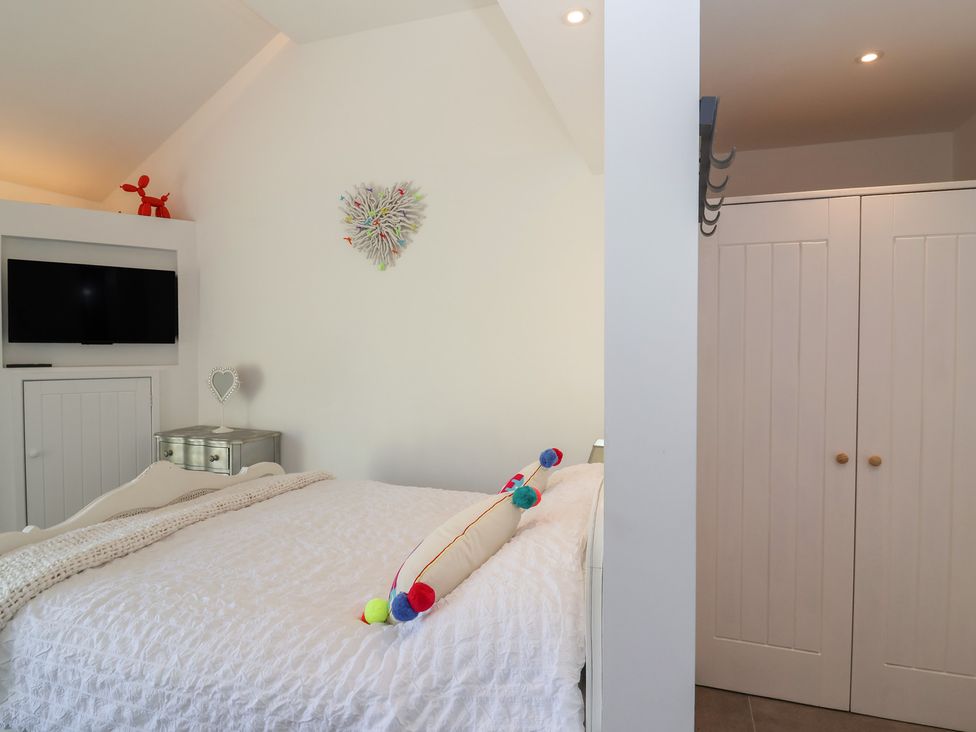 A bedroom with a bed and television at Ninky Nonk in Bristol